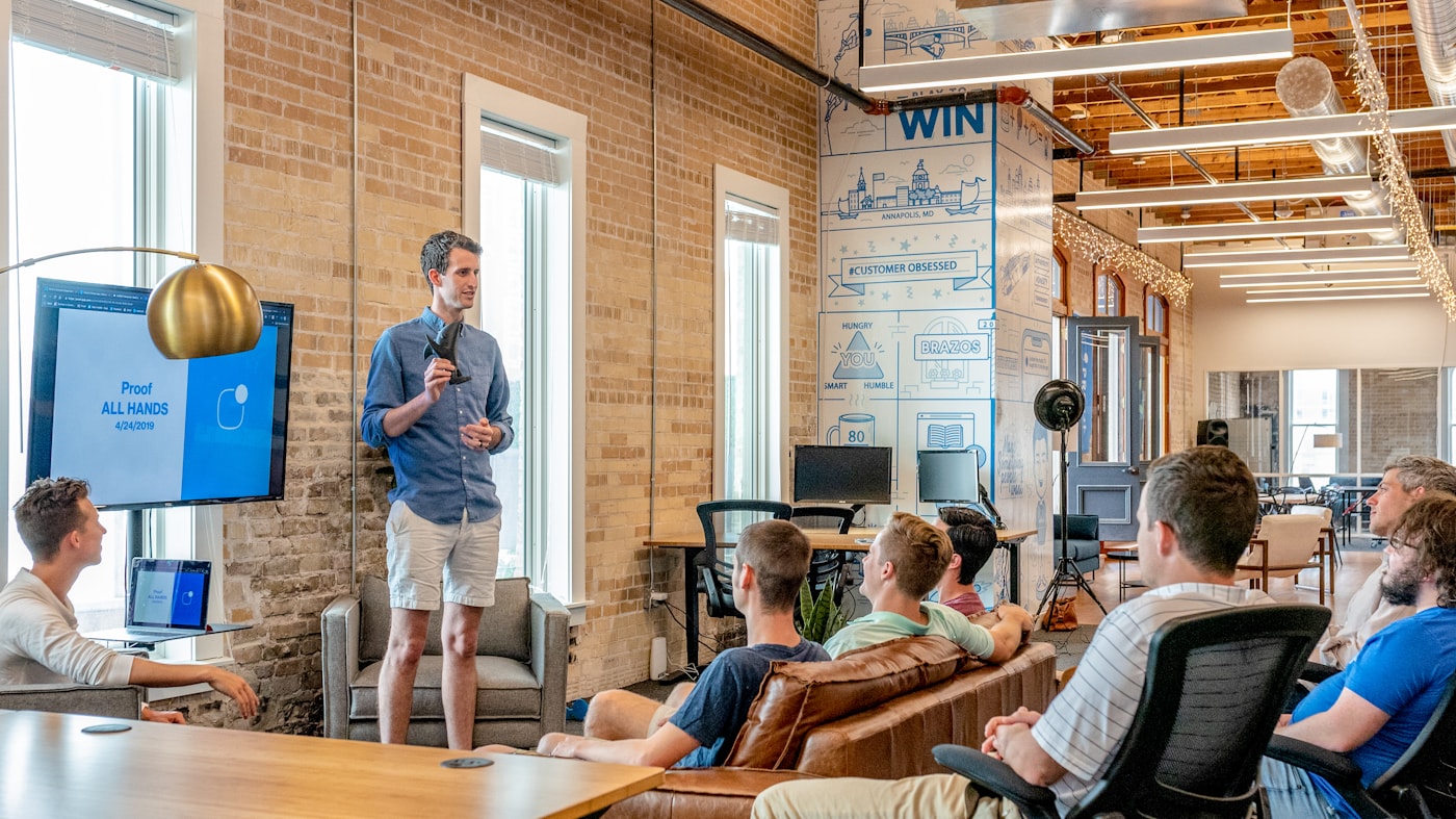 Consultant leading a delivery workshop in a modern office
